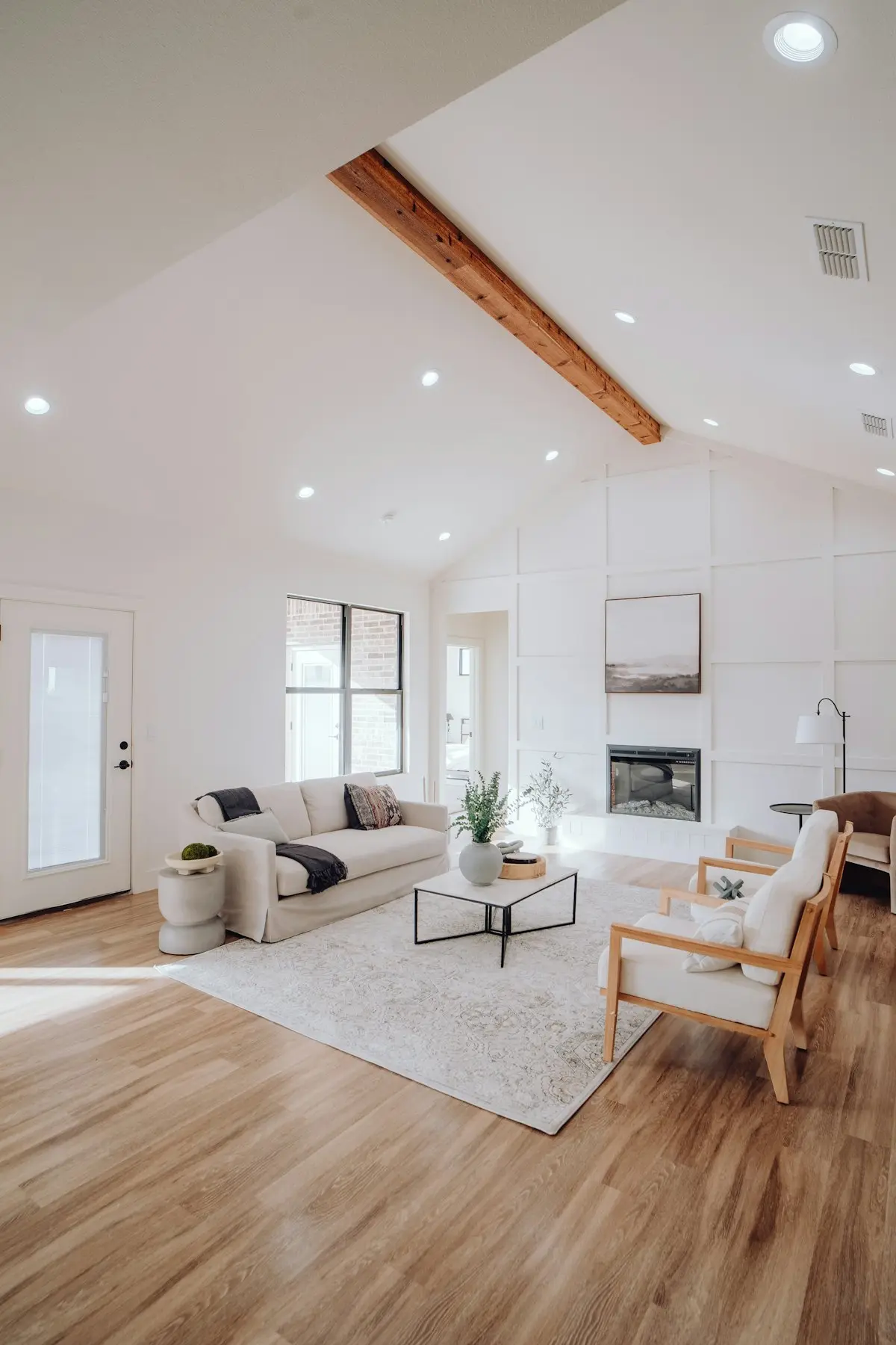 Bright residential living room with visible ceiling air vents